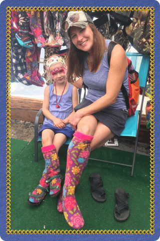Mother and child wearing colorful Twinkle Toes socks at a vendor market in Palmer, Alaska