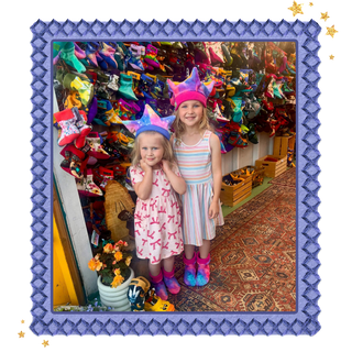 Children wearing colorful Twinkle Toes hats and all-terrain socks inside the Twinkle Toes booth at the Alaska State Fair.